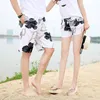 Couple Pantal Pantalon Seaside Vacation Derying Drying Loose Plus Shorts de taille Men and Femmes Natation de printemps chaud Big Pantal