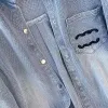 Camisa de jeans de jeans de bordados retro femininos Jaqueta casual da primavera feminina e outono 2024 Novo camisa de emagrecimento solta de comprimento médio