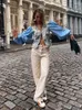 Blusas femininas imprimem a retalhos de retalhos camisa floral feminino de decote em vaca com lanterna de fivela de lanterna em vaca Cardigan feminino 2024 Summer Lady Streetwear