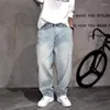 Jeans masculin American Retro Mens Loose Fit Fit Casual Hip Hop Harem Pants en détresse Denim Streetwear Cowboy