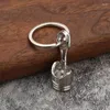 Keychains Car Moteur de voiture Piston Keychain Pendre Zinc Pendre Créative Key Ring Chain pour hommes Boys Pilotes Cadeaux Accessoires automobiles