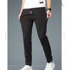 Pantalon pour hommes printemps automne élastique midi à la taille lacet up up décontracté la mode homme couleur solide pantalon pantalon raide masculin vêtements