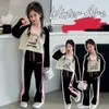 Kledingsets Koreaanse lente herfst kinderen gir tracksuit elementair meisje contrast gedrukt shirt rechte broek school 2 stks kleding set