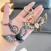 Keychains Opal Eagle Spreading Wings Retro Metal Kelechain Men Car Crystal Bijoux Bijoux ACCESSOIRES CADE