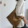 Nouveau sac de style chinois texturé en tissu gris en une pièce un sac indépendant en cuir à la corde en cuir à la corde à main sac à main