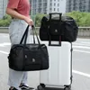 Stume di stoccaggio Donne pieghevoli Viaggio di grande capacità portatili impermeabili a spalla singola mano bagaglio a mano uomo che muove l'organizzatore