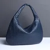 High-end grote capaciteit forens Dumpling Bag geweven schoudertas voor vrouwen 2024 Koreaanse versie retro okselzaktas designer tas