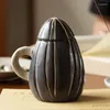 Canecas Creative Cartoon Creative Creca de Cerâmica em forma de sementes de girassol à mão Com tampa avançada de chá de chá de café fofo avançado xícaras de leite