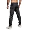 Pantaloni da jogging elastici uomini che corrono più dimensioni con cimpelli sportivi con cerniera fitness da palestra jogger di bodybuilding pantaloni sportivi 240412 240412