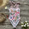 Menas de banho feminina Double -Sidlaided Wear One Piece Swimsuit 2024 PRIMIDADE CARTA MULHER MULHER PROJO BAIO BAIO MONOKINI NATA