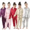 Småbarn Baby Girls Boys Silk Pyjamas Långärmad solid knapp-ner Satin Pyjamas Set Kids Pyjamas Nightgowns Children Sleepwear 240410