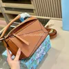 Manusear bolsa lychee loe moda quebra