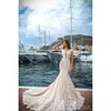 Full 2017 Lace Sirène Magnifique robes de mariée Deep V Coup Capp Capaged Court Train Beach Bridal Robes Sheer Back Vestidos de Noiva Estidos