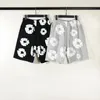 Kvinnors shorts y2k kläder trendiga hip-hop-dragkonstbeslor springrar mens y2k blomma tryck shorts löst och wideleg byxor 240426