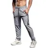 Pantaloni da jogging elastici uomini che corrono più dimensioni con cimpelli sportivi con cerniera fitness da palestra jogger di bodybuilding pantaloni sportivi 240412 240412