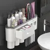 Porte-brosse à dents muraux avec 2 dispensateur de dentifrice Rangement de salle de bain sans punch pour les accessoires de salle de bain imperméables à la maison 240419