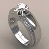 Eheringe exquisite Frauen silberne Farbe Wasserdrop Metall eingelegtes weißes runde Zicron Stones Ring Set Hochzeitsverlobungsringe Schmuck