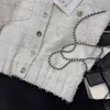 Luxury designer women's jacket Early Spring New Gentle Girl Style Simple and Fresh Round Neck Single breasted Short sleeved Knitted Top