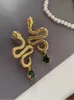 Boucles d'oreilles bijoux modernes Neignel Boucles d'oreilles de serpent Personnalité Cool Metallic Gold Couleur en verre vert Lignes d'oreilles pour femmes Gift 230831
