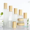 wholesale Frosted Glass Cosmetic Jar Bottle Face Cream Pot Lotion Spray Pump Bottles with Plastic Imitation Bamboo Lids