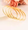 Gioielli braccialetti a cerchio di moda gioielli solidi oro giallo oro giallo Dubai linee oblique per donne regali nuziali arabi 4pcs 65mm6376711