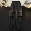 Calça masculina Marca de moda de outono/inverno Vestido de trabalho emendado japonês Strap 3D bolso solto e versátil bonito casual