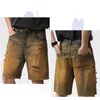 Heren jeans 2024 zomer denim shorts mannen los fit hiphop baggy noodlijdende holle out retro geel gerafeld brede been