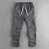 Calças masculinas Primavera e verão New American Retro Tecida Terticidade da cintura elástica masculina lavada calça casual reto solta H240429