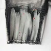Nuovi cortometraggi con bordi elastici del marchio viola con cortometraggi di denim perforati americani irregolari