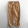 Pantalon pour hommes de longueur de cheville pour hommes blancs blancs minces vêtements coréens harem décontracté pour les hommes à rayures à rayures vintage plus taille