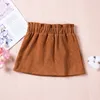 Skirts Spring ldren Baby Girls Skirts 0-4Y Cute Sweet Bow Button A-Line Skirts Autumn Girls Solid Fashion Clothing H240509