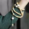 Strang gelbe Leder verwitterte Wurzelhandkettensamen 108 Armband Weiß Jade Bodhi Halskette Dame Accessoires Geschenk Frauen Geschenk