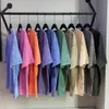 Camisetas lisas de algodón de gran tamaño de color puro angustiado y angustiado para mujeres Topas de verano camisas para hombres Camas 240428