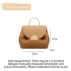 2024 Contrasto del marchio francese Contrasto Litchi Pattern Borse Smiling Face Borse Crossbody Borsa Triplo maialino colorato 240420