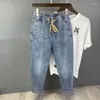 Jeans masculins denim de mode coréen d'été avec taille élastique et pantalon harem Design Drawtring vintage Baggy Man