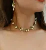 Chaines Aensoa Personnalité Collier de feuilles florales blanches émail alliage tendance Lily Valley Gold Color Choker pour les femmes de haute qualité 3516744