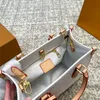 Lita de ombro largo com bolsa de bolsa de designer de alta qualidade com uma pequena bolsa redonda de metal de ouro grande bolsa de compras de verão bolsa de praia de verão