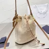 Sac de concepteur haut de gamme Sac de godet de loisirs Sac de loisirs en matériau tissé paille peut être transporté à travers le corps livraison gratuite