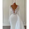 Sparkly Mermaid Wedding Jurken Sexy Pearls Beading Sheer V Neck Long Sleeve kralen Bruidsjurken Robe de Soiree