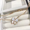 Van Cl AP Classic High Version V Gold Natural White Fritillaria Collier Butterfly CNC CNC Finement sculpté à plateau épais 18 km chaîne de clavicule de pendentif rose