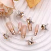 TSZS 10pcs роскошные кружевные лук -ролики ногти Art Charms 3D Pink Clear Red Diamond Butterfly Metal Decorary Accesoires 240425