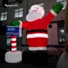 Partihandel Fantastisk röd jätte Uppblåsbar Santa Father Christmas Figure Model Luft upp Saint Nicholas som håller ett skylt för Xmas utomhusdekoration