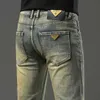 Kong Hong Brass Denim Jeans for Men highded distred and Light Luxury Trendy Slim Fit Small Leg Long Pants秋の冬の太いスタイル