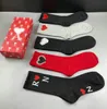 Men's and women's stockings sports cotton socks luxury socks Joker solid color classic hook ankle breathable black and white basketball football garter box.