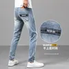 Jeans masculin printemps d'été mince masculin slim slim américain calicon marque haut de gamme petit pantalon droit Q9574-07