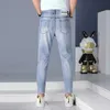 Jeans Point Nove para homens Marca fina de verão Distrava a versão lisa Blue European Slim Fit Leggings