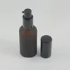 Bottiglie di stoccaggio ad alta quangetà da 50 ml bottiglia di pompa a lozione rotonda vuota con vetro nero all'ingrosso