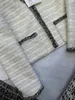 Projektantka kurtki damskiej wczesna wiosna Nowa celebrytka ciężka przemysł tkany ręcznie robiony diamentowy i wszechstronny, gruby tweedowy płaszcz