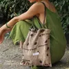 Nouveau sac de style chinois jupe longue décontractée avec sac en satin zen corde de vache de vache pure coton lin de style folie