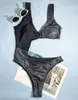 Femminile da bagno femminile 2024 Arrivo a un pezzo da donna set di bikini set nero patchwork snow -out da donna costume da bagno sexy abbigliamento da spiaggia